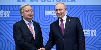 Vladimir Putin und Antonio Guterres