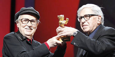 Directors Vittorio (L) and Paolo Taviani hold the Golden Bear