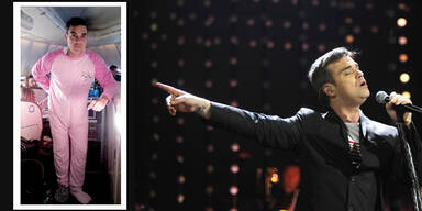 Robbie Williams trägt rosa Babystrampler
