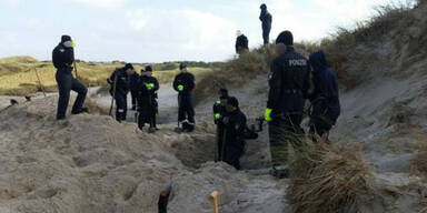 Flüchtling getötet und im Sand vergraben