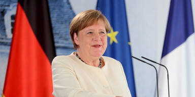 Merkel lüftet ihr Masken-Geheimnis