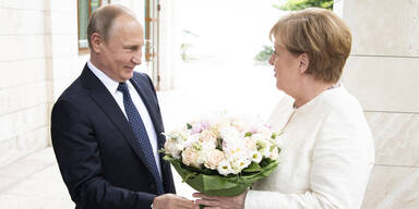 Putin Merkel