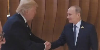 Erster Handshake zwischen Putin und Trump